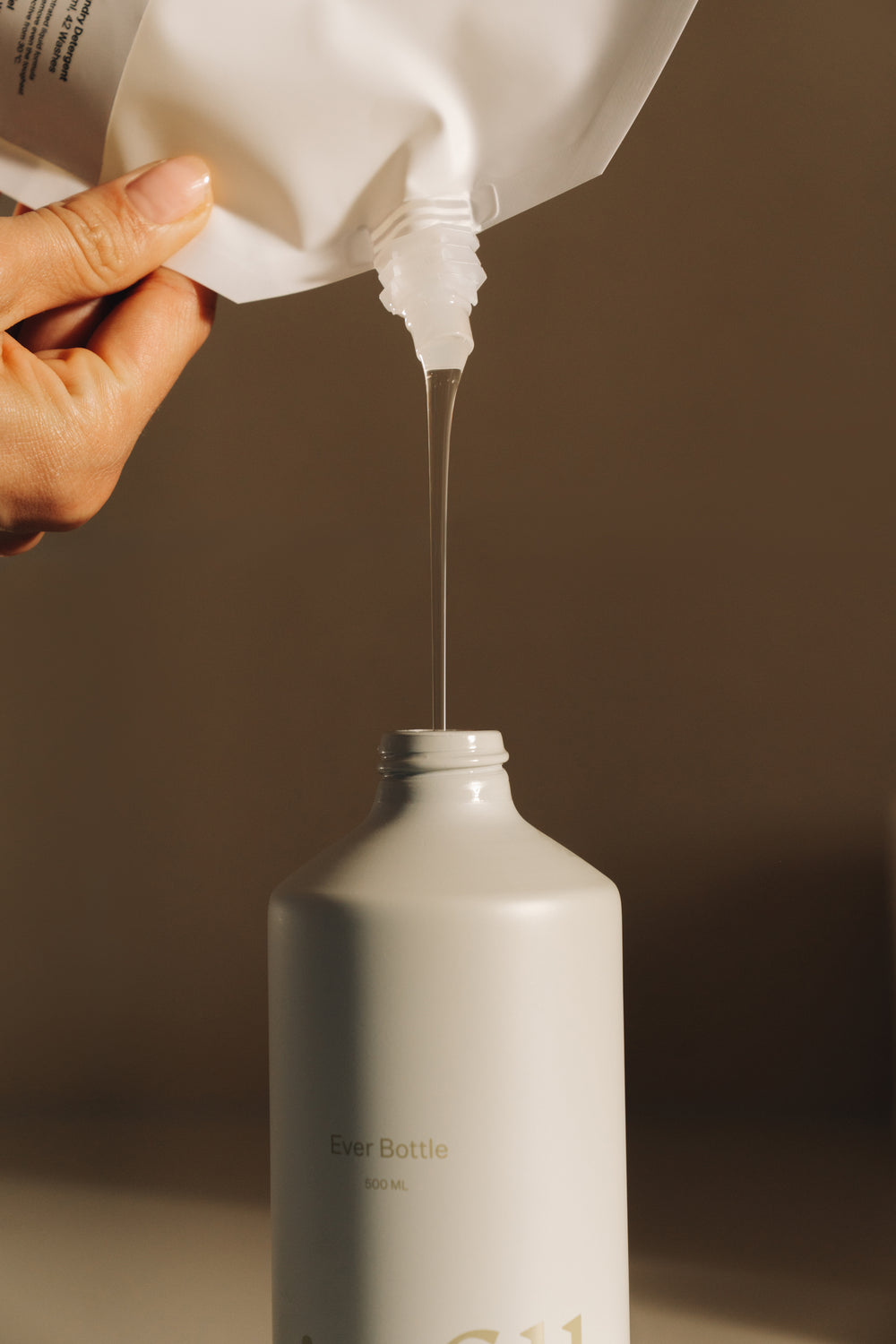 Fill the bottle with the pouch